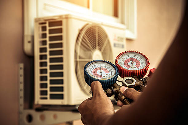 Professional Air Conditioning Service technician working in Byram, CT